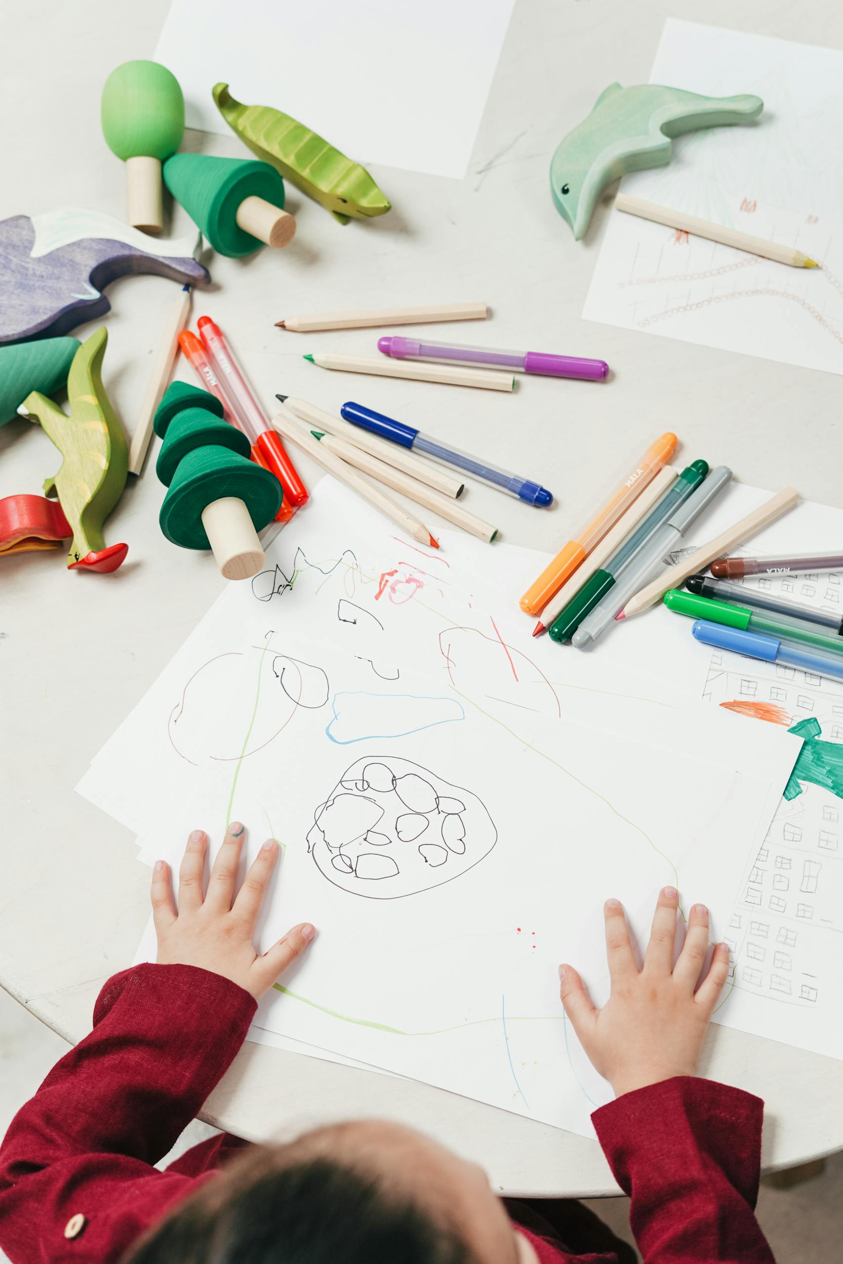 Kid On White Table Painting